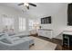 Bright living room features plantation shutters, ceiling fan, and modern decor at 2601 Boulder Way, Woodstock, GA 30188