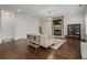 Cozy living room with a stone fireplace and hardwood floors at 2601 Boulder Way, Woodstock, GA 30188