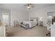 Spacious main bedroom showcasing a comfortable bed, neutral décor, and a peaceful atmosphere at 2601 Boulder Way, Woodstock, GA 30188