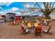 Inviting outdoor seating area with Adirondack chairs and picnic tables under the open sky, perfect for gatherings at 2601 Boulder Way, Woodstock, GA 30188