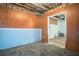 Unfinished basement space showing wooden paneled walls, concrete, and open ceiling at 541 Exam Ct, Lawrenceville, GA 30044