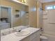 Bathroom featuring a tub and shower combo, and a large mirror at 541 Exam Ct, Lawrenceville, GA 30044