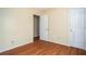 Bedroom with wood flooring and neutral-colored walls at 541 Exam Ct, Lawrenceville, GA 30044