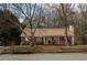 Charming brick home with inviting front porch and mature trees in a quiet neighborhood at 541 Exam Ct, Lawrenceville, GA 30044