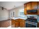 Cozy kitchen area with stainless steel appliances and access to the back deck at 541 Exam Ct, Lawrenceville, GA 30044