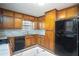 Charming kitchen with wood cabinets, sleek appliances, and bright countertops at 541 Exam Ct, Lawrenceville, GA 30044