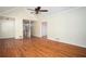 Spacious living room with hardwood floors, staircase and multiple entryways at 541 Exam Ct, Lawrenceville, GA 30044