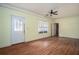 Living room featuring a ceiling fan and wood flooring at 541 Exam Ct, Lawrenceville, GA 30044