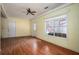 Living room featuring a ceiling fan and wood flooring at 541 Exam Ct, Lawrenceville, GA 30044