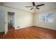 Inviting bedroom features a tray ceiling, ceiling fan, and hardwood floors at 541 Exam Ct, Lawrenceville, GA 30044