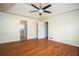 Open bedroom featuring neutral walls, fan and ensuite bath at 541 Exam Ct, Lawrenceville, GA 30044