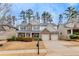 Attractive two-story home with a large front yard and attached garage at 108 Lakestone Pkwy, Woodstock, GA 30188