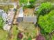 Charming home with long driveway, mature trees, and lush landscaping at 1765 Round Rd, Grayson, GA 30017