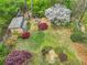 Aerial view of an expansive backyard with fire pit, shed, and lush landscaping at 1765 Round Rd, Grayson, GA 30017