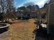 Spacious backyard with a stone fire pit at 1765 Round Rd, Grayson, GA 30017