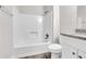 Bathroom with gray vinyl flooring, white toilet, granite countertop and white tiled shower at 1765 Round Rd, Grayson, GA 30017