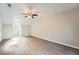 Bright bedroom with vaulted ceiling, ceiling fan, gray walls, and durable laminate flooring at 1765 Round Rd, Grayson, GA 30017