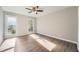 Bedroom with natural light, hardwood floors and a ceiling fan at 1765 Round Rd, Grayson, GA 30017