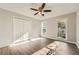 Bedroom features natural light, a large closet, and modern ceiling fan at 1765 Round Rd, Grayson, GA 30017