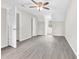 A spacious bedroom featuring gray vinyl flooring, neutral walls, and a ceiling fan at 1765 Round Rd, Grayson, GA 30017