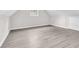 Versatile bonus room featuring hardwood floors and a window, ideal for a home office or playroom at 1765 Round Rd, Grayson, GA 30017