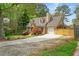 Charming home with dormer windows, well-maintained lawn, and attached garage at 1765 Round Rd, Grayson, GA 30017
