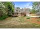 Charming home with lush front yard and attached garage behind wooden privacy fence at 1765 Round Rd, Grayson, GA 30017
