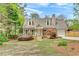 Charming home with dormer windows, well-kept lawn, and attached garage at 1765 Round Rd, Grayson, GA 30017