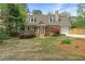 Charming home with well-kept lawn, dormer windows, and attached garage at 1765 Round Rd, Grayson, GA 30017