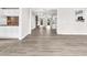 Bright, open-concept living room featuring hardwood floors, a fireplace, and an eat-in kitchen at 1765 Round Rd, Grayson, GA 30017