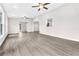 Spacious, airy living room with hardwood flooring and multiple windows for ample natural light at 1765 Round Rd, Grayson, GA 30017