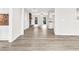 Bright, open-concept living room featuring hardwood floors, a fireplace, and an eat-in kitchen at 1765 Round Rd, Grayson, GA 30017