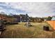 A large backyard with a playset and a view of the home's exterior at 3028 Hallman Cir, Marietta, GA 30064