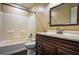 Bathroom with a bathtub, toilet, and a dark wood vanity at 3028 Hallman Cir, Marietta, GA 30064