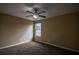 Neutral bedroom featuring plush carpeting, a ceiling fan, and natural light from a window at 3028 Hallman Cir, Marietta, GA 30064
