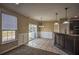 Bright dining area with sliding doors, stylish lighting and wainscoting at 3028 Hallman Cir, Marietta, GA 30064