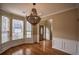 Charming dining room with hardwood floors, natural light and decorative chandelier at 3028 Hallman Cir, Marietta, GA 30064