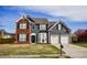 Charming two-story home featuring a two-car garage, brick accents, and a well-manicured lawn at 3028 Hallman Cir, Marietta, GA 30064