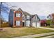 Inviting two-story home showcasing a manicured lawn, two-car garage, and attractive brick and siding at 3028 Hallman Cir, Marietta, GA 30064