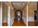Inviting foyer with hardwood floors, arched doorway, decorative molding, and neutral paint at 3028 Hallman Cir, Marietta, GA 30064