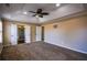 Spacious primary bedroom featuring tray ceilings, ceiling fan and plush carpet at 3028 Hallman Cir, Marietta, GA 30064