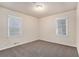 Cozy bedroom with neutral walls, soft carpet, recessed lighting, and windows providing ample natural light at 2212 Brannen Se Rd, Atlanta, GA 30316