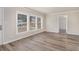 Bright living room showcasing large windows and luxury vinyl plank flooring at 2212 Brannen Se Rd, Atlanta, GA 30316