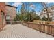 Large, stained wooden back deck perfect for entertaining at 29 Cliftwood Dr, Sandy Springs, GA 30328