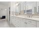 Elegant bathroom showcasing double vanity with granite counters and modern fixtures at 29 Cliftwood Dr, Sandy Springs, GA 30328