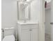 Clean bathroom with a toilet, vanity, framed mirror, and a shower/closet area at 29 Cliftwood Dr, Sandy Springs, GA 30328