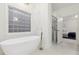 Luxurious bathroom featuring a freestanding tub and a separate glass-enclosed shower at 29 Cliftwood Dr, Sandy Springs, GA 30328