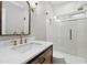 Modern bathroom with marble countertop, stylish fixtures, and walk-in shower with tile at 29 Cliftwood Dr, Sandy Springs, GA 30328