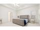 Well-lit bedroom with tray ceilings, plantation shutters, and neutral decor at 29 Cliftwood Dr, Sandy Springs, GA 30328