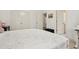 This bedroom showcases a patterned bed, modern decor, and white walls complemented by carpeted floors at 29 Cliftwood Dr, Sandy Springs, GA 30328